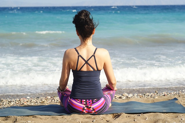 Person Meditating On Beach